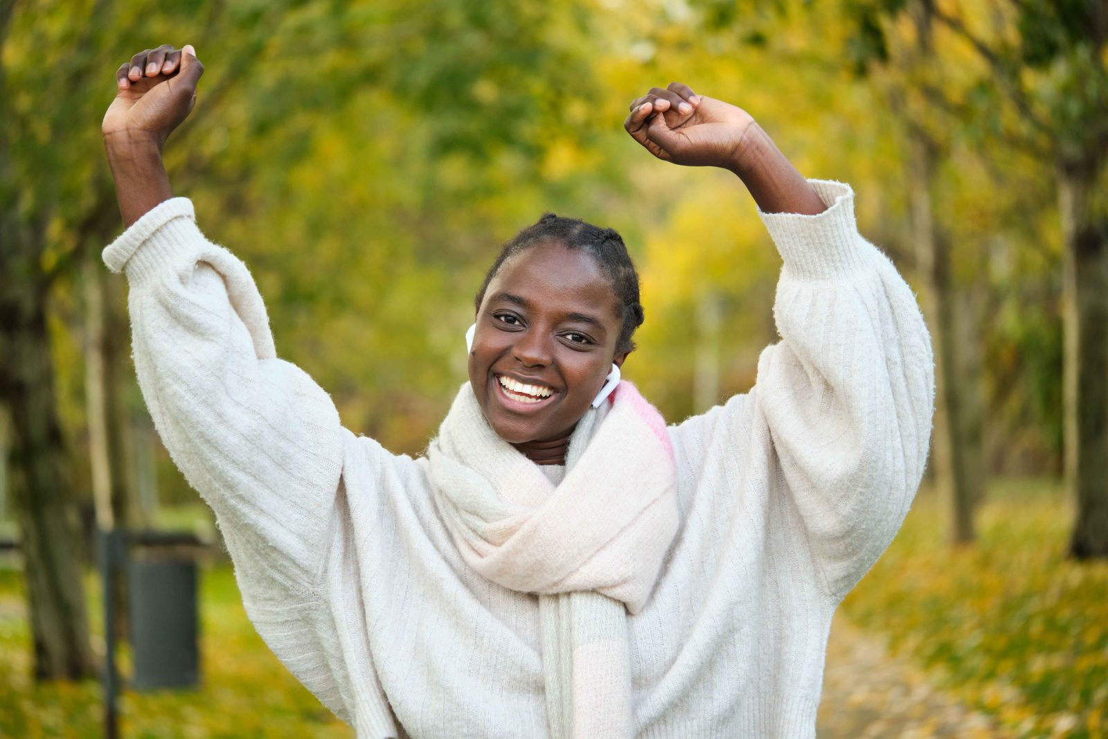 smiling woman celebrating fitness victory in park 2026 01 08 23 58 30 utc 11zon