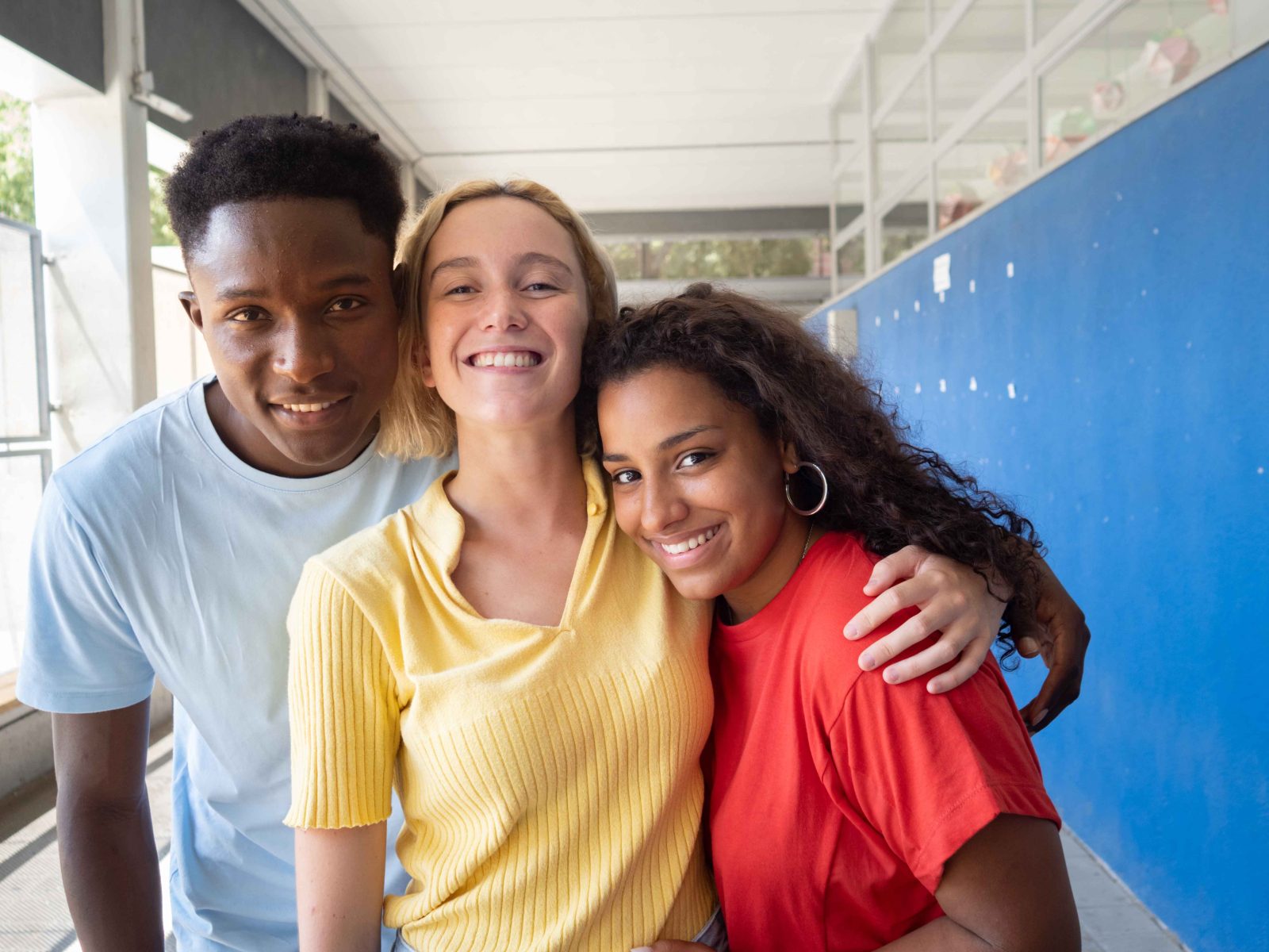 three happy teens posing indoors at school 2026 01 07 05 39 07 utc 11zon